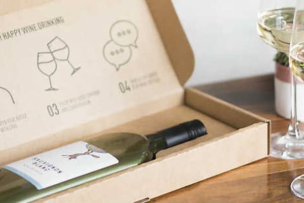 Open box of Garcon wine on a table