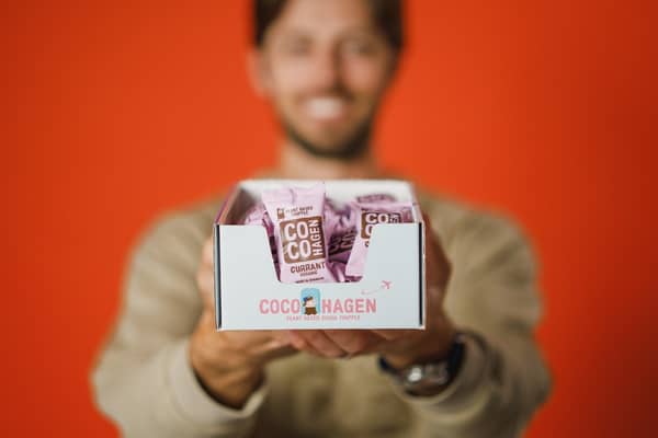 Cocohagen Packaging in front of a blurred man