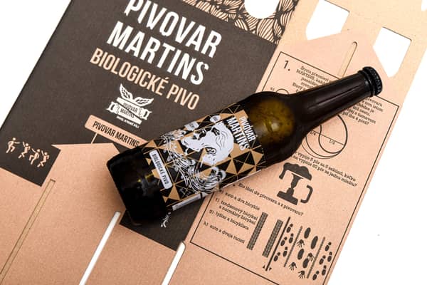 A Martins Brewery beer bottle on top of the 6-packhandle cardboard packaging solution by DS Smith