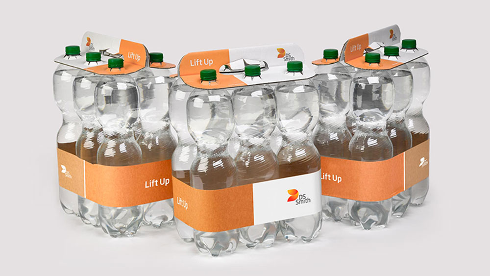 PET-pulloja joissa ei ole muovikalvoa ryhmäpakkauksessa vaan pahvinen kahva ja paperipanta