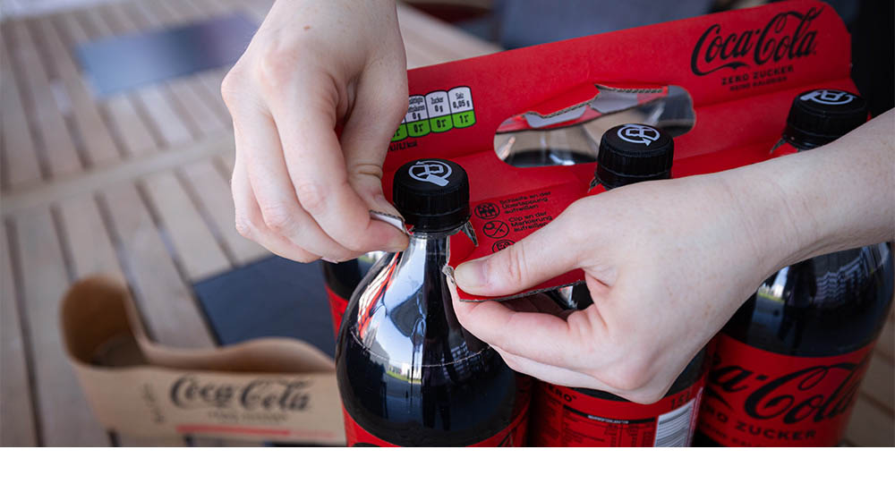 Kartonnen handvat voor 6 flessen Coca Cola